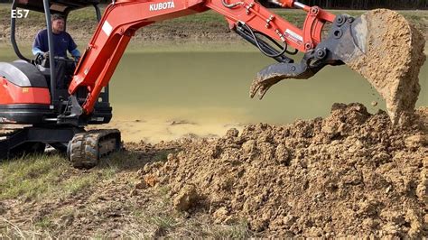 using a mini excavator to dig a pond|Digging a Small Pond with Only an Excavator 002 .